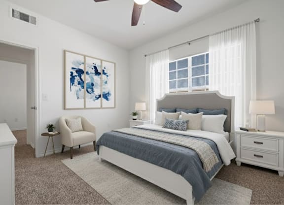 A bedroom with a large bed, a chair, and a painting on the wall.