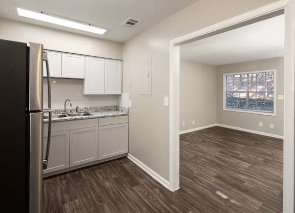 a kitchen and dining area in model unit