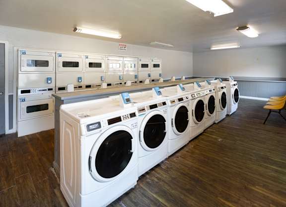 a row of washing machines in a public laundromat