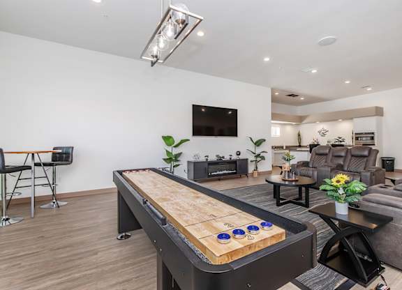 A shiny pool table in a well lit room.
