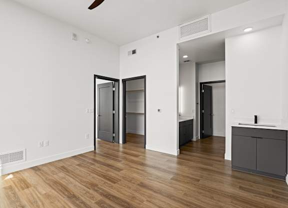 A room with a wooden floor and white walls.