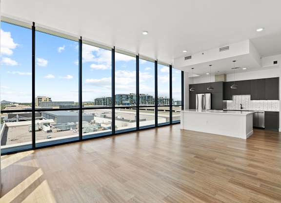 A modern kitchen with a view of the city.