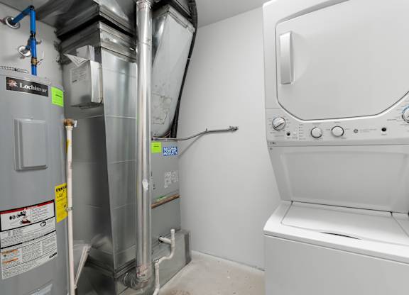 A washing machine and dryer in a small laundry room.