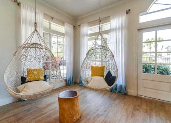 two hanging hammock chairs in a living room
