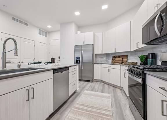 Kitchen with White Cabinets at Coya Apartments, Nevada