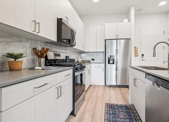 Kitchen with Refrigerator at Coya Apartments, Las Vegas, NV