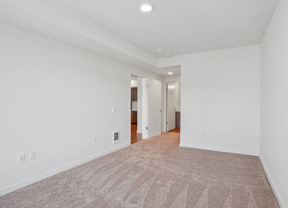 Bedroom with carpeted floor at Hana Apartments, Hillsboro, 97006