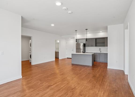 Kitchen with wooden floors at Hana Apartments, Hillsboro, OR