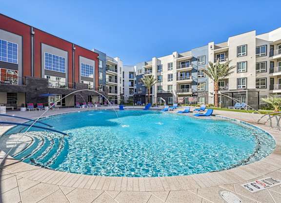 A large outdoor swimming pool at Fora Apartments, Las Vegas, NV 89183