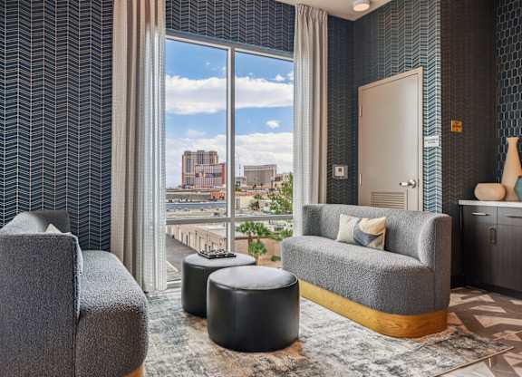 Living Room with a Grey Sofa at Coya Apartments, Las Vegas