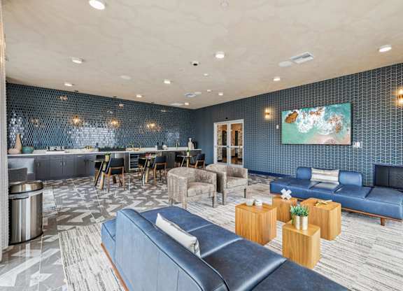 Living Room with Blue Couch at Coya Apartments, Las Vegas, NV, 89102