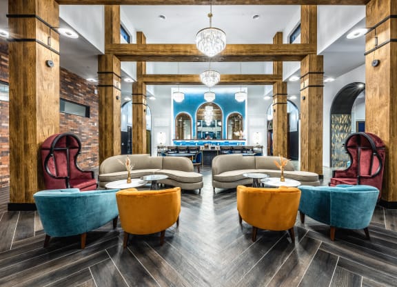 the lobby of a restaurant with tables and chairs and a bar at The Alibi at Lake Lilly, Ocoee, FL