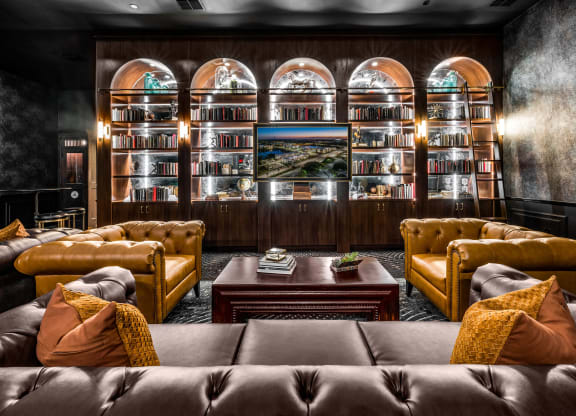 a living room with couches and a coffee table at The Alibi at Lake Lilly, Ocoee, 34761