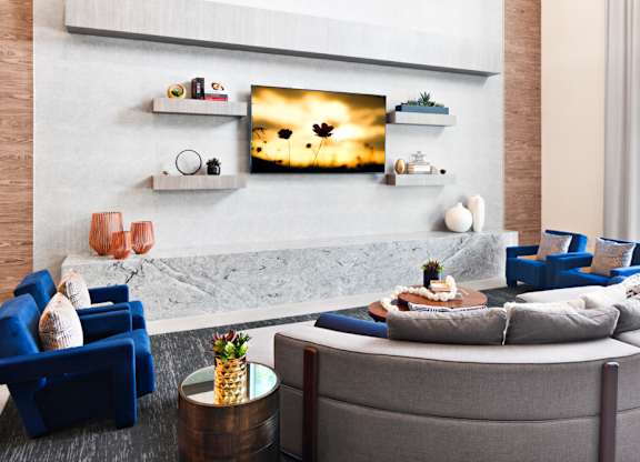 a living room with a couch and a table at Aura Vegas Apartments, Las Vegas
