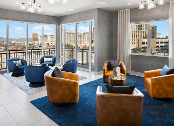 a lounge area with chairs and a view of the city at Aura Vegas Apartments, Las Vegas, Nevada