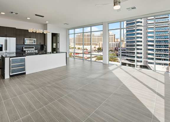 a living room with a view of a skyscraper at Aura Vegas Apartments, Las Vegas, NV