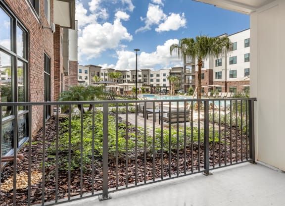 the preserve at cardinal heights balcony view of pool and buildings at The Haven at Lake Britt Apartments, Winter Garden, FL