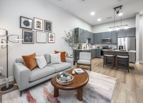 a living room with a couch and a table at The Haven at Lake Britt Apartments, Winter Garden, Florida