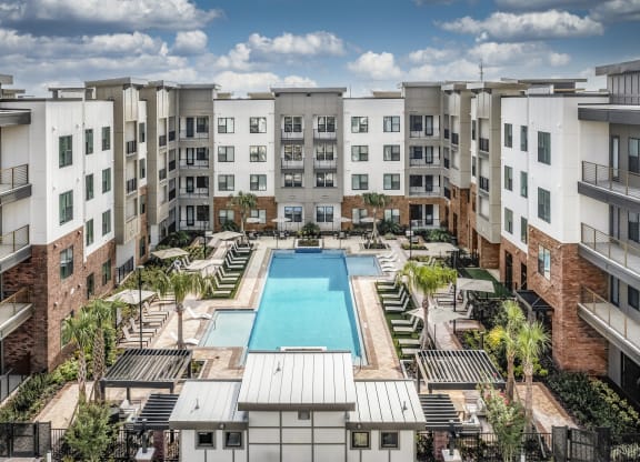 an overhead view of an apartment building with a swimming pool at The Haven at Lake Britt Apartments, Winter Garden, FL