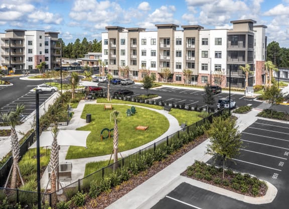 an aerial view of an empty parking lot at an apartment complex at The Haven at Lake Britt Apartments, Winter Garden, FL 34787