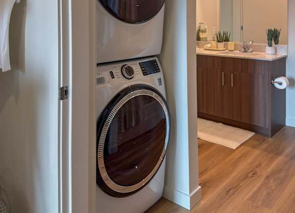 Stacked washer and dryer in closet alcove at Montage Apartments, Tigard, 97223
