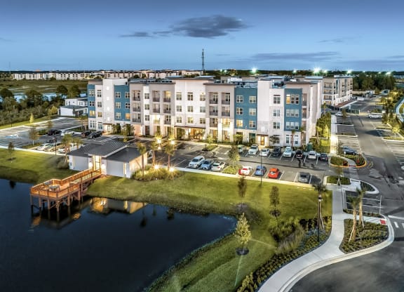 an aerial view of an apartment building overlooking a body of waterat The Overlook, Winter Garden