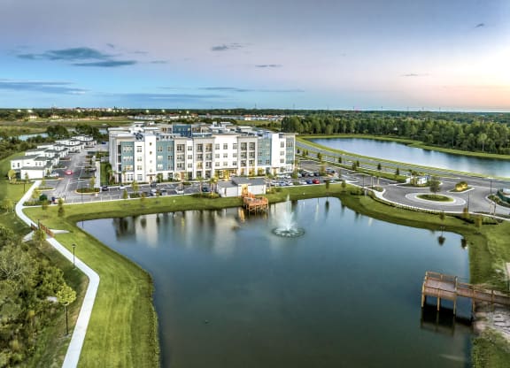 an aerial view of an apartment complex overlooking a lake at The Overlook, Winter Garden