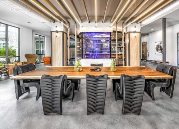 a conference room with a large wooden table and chairs at The Overlook, Winter Garden, FL