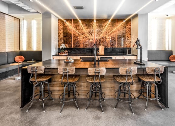 a large bar with bar stools in a room with a couch and a mirrorat The Overlook, Winter Garden, Florida