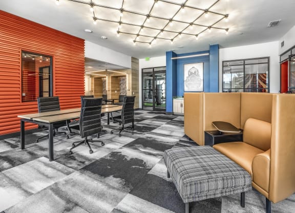 a conference room with chairs and tables and a couch at The Overlook, Winter Garden
