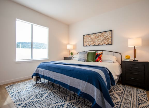 a bedroom with a bed and a windowat Scouter's Mountain, Happy Valley, OR