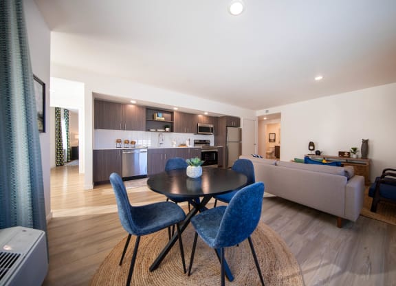a living room with a table and chairs and a kitchenat Scouter's Mountain, Happy Valley, 97086