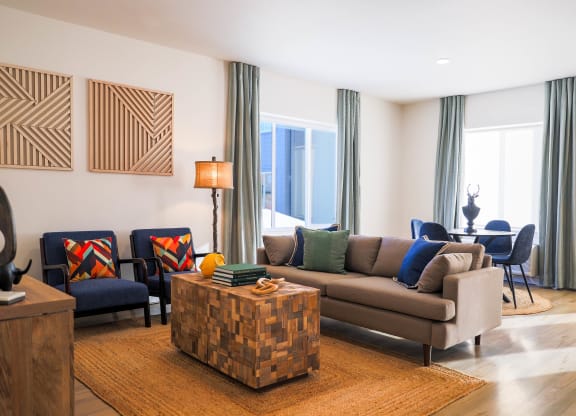 a living room with a couch and chairs and a tableat Scouter's Mountain, Happy Valley Oregon