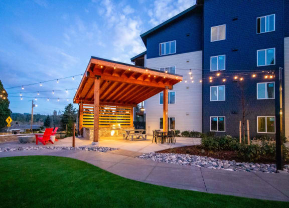 a patio with a wooden pavilion at nightat Scouter's Mountain, Happy Valley, OR 97086