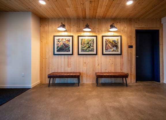 a room with two benches and three paintings on the wallat Scouter's Mountain, Oregon