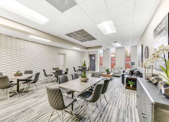 A conference room with a long table surrounded by chairs. at Academy at Drexel Apartments, Chicago