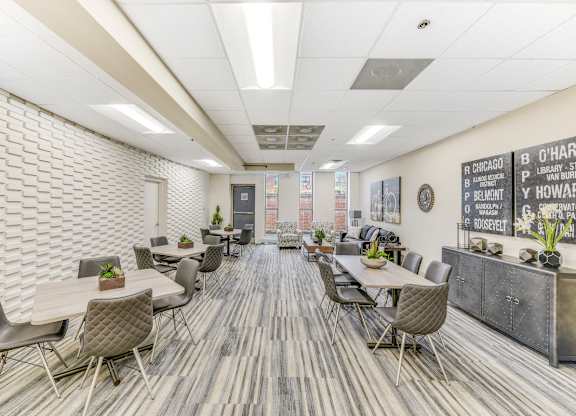 A conference room with a long table surrounded by chairs. at Academy at Drexel Apartments, Illinois, 60637
