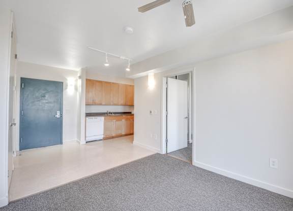 A spacious living room with a kitchen in the background. at Acton Courtyard, Berkeley, 94703