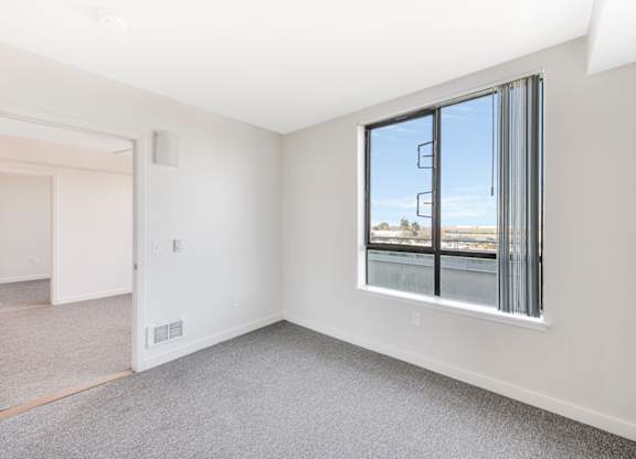 A room with a large window and a view of the outside. at Acton Courtyard, California