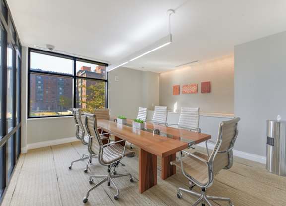 A conference room with a long table and chairs. at Affinity at 2M, Washington, 20002