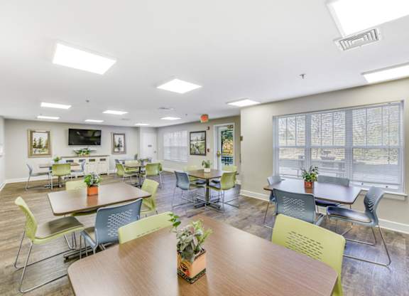 A conference room with a long table and chairs at Manor at Victoria Park,  Maryland