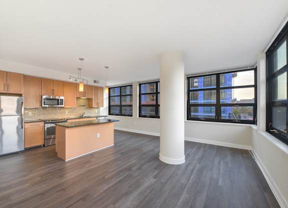 A kitchen with a refrigerator, microwave, and oven. at Affinity at 2M, Washington, 20002