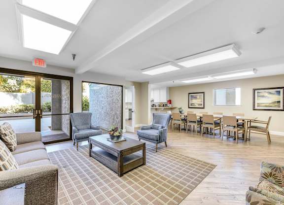 A living room with a grey couch and a coffee table.