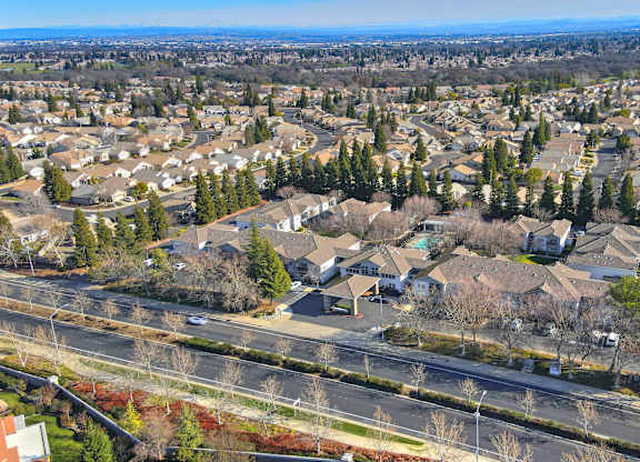 A suburban neighborhood with houses and trees.