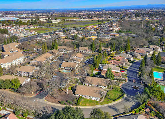 A residential area with houses and roads.