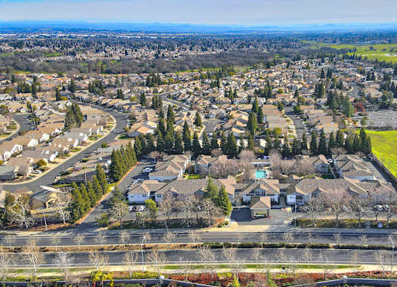 A suburban neighborhood with houses and trees.