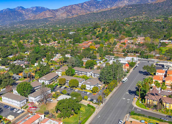 A suburban area with houses and a mountain in the background.