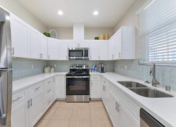 Kitchen with white cabinets at Norden Terrace Apartments, California, 95660