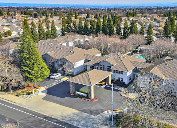 A view of a residential area with houses and trees.