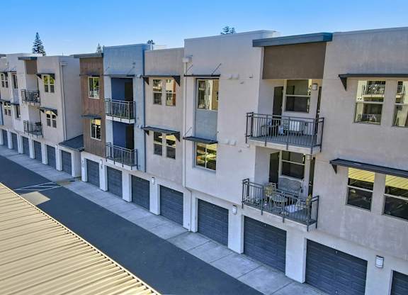 Modern townhomes with attached garages at Anton Arcade Apartments, California